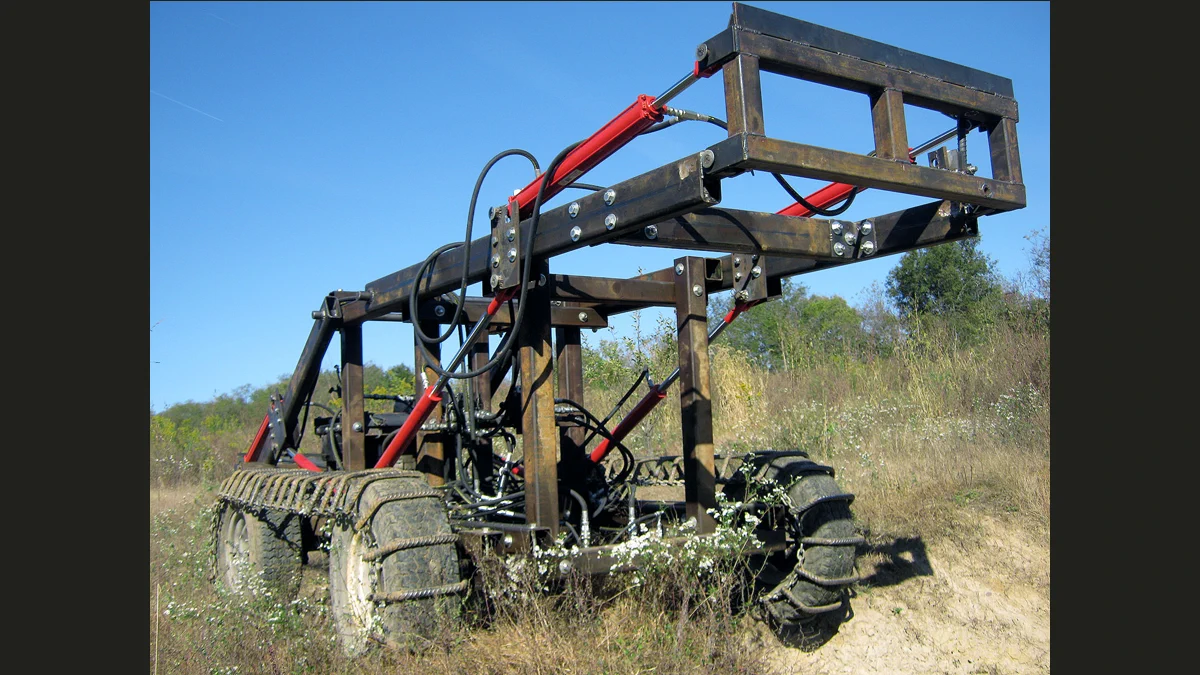 A real Open Source Ecology LifeTrac tractor photographed outdoors against a clear blue sky.