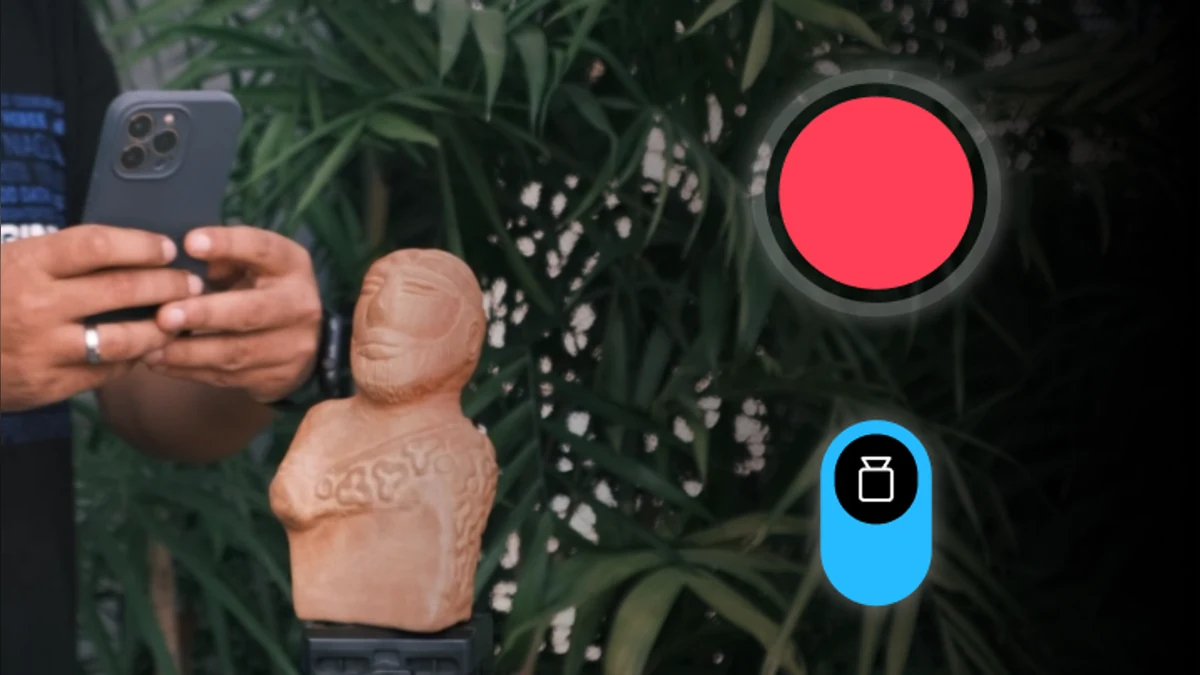 Person using RealityScan Mobile to scan a small sculpture with a phone